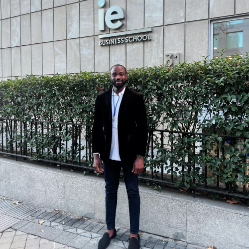 Image of Chuma Ojukwu infront of IE Business School