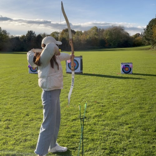 Image of MSc student doing archery
