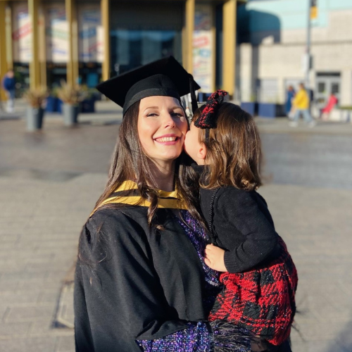 Katerina at graduation with her child