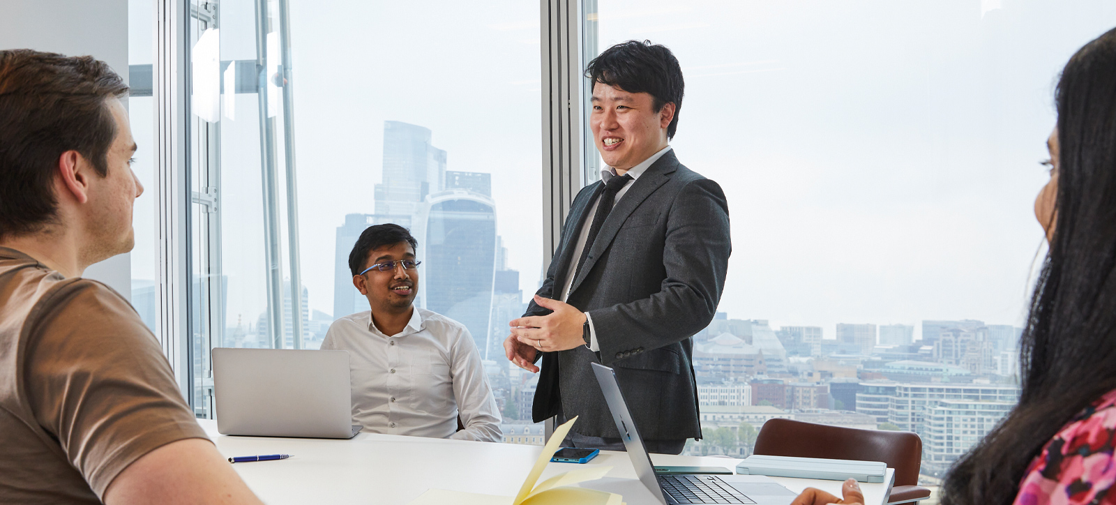 Students talking together around table