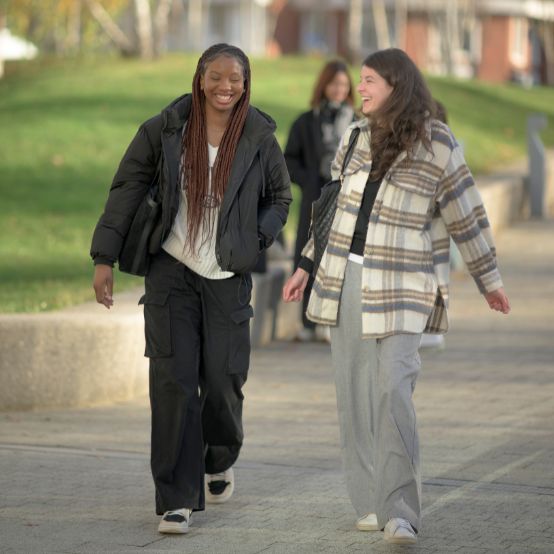 Teodora and friend walking on campus