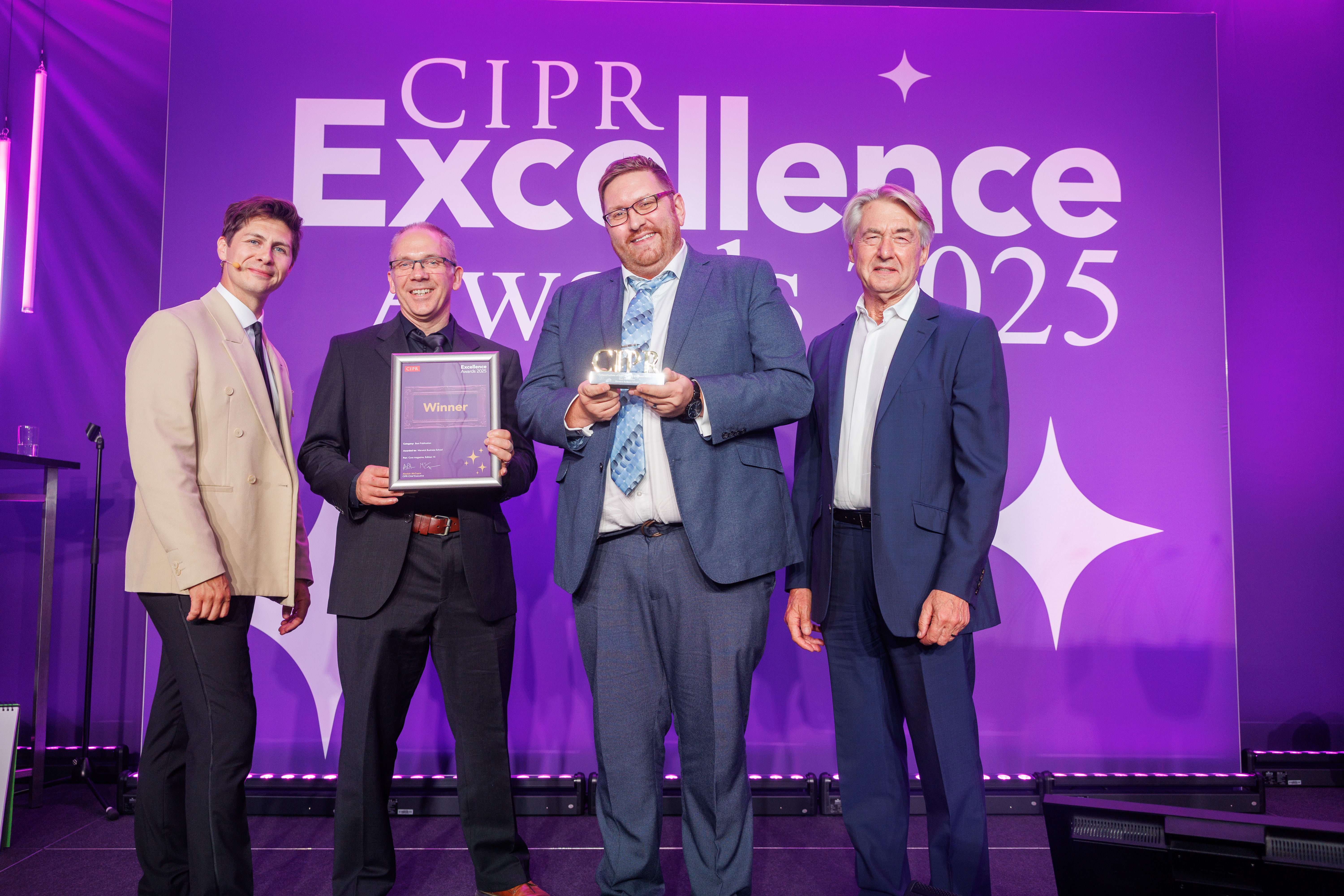TV magician Ben Hanlin (left) presents senior design Mark Udall and Core magazine editor Warren Manger with the award for Best Publications at the CIPR Excellence Award.