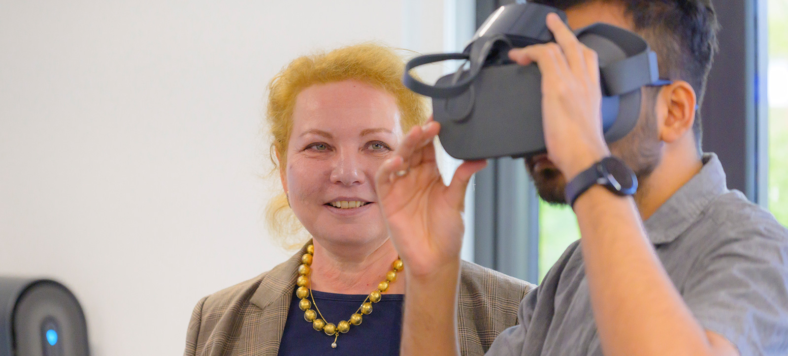 Dr Iryna Tykhomyrova, President of the International Management Institute in Kyiv, is shown the virtual reality technology in the Gillmore Centre for Financial Technology