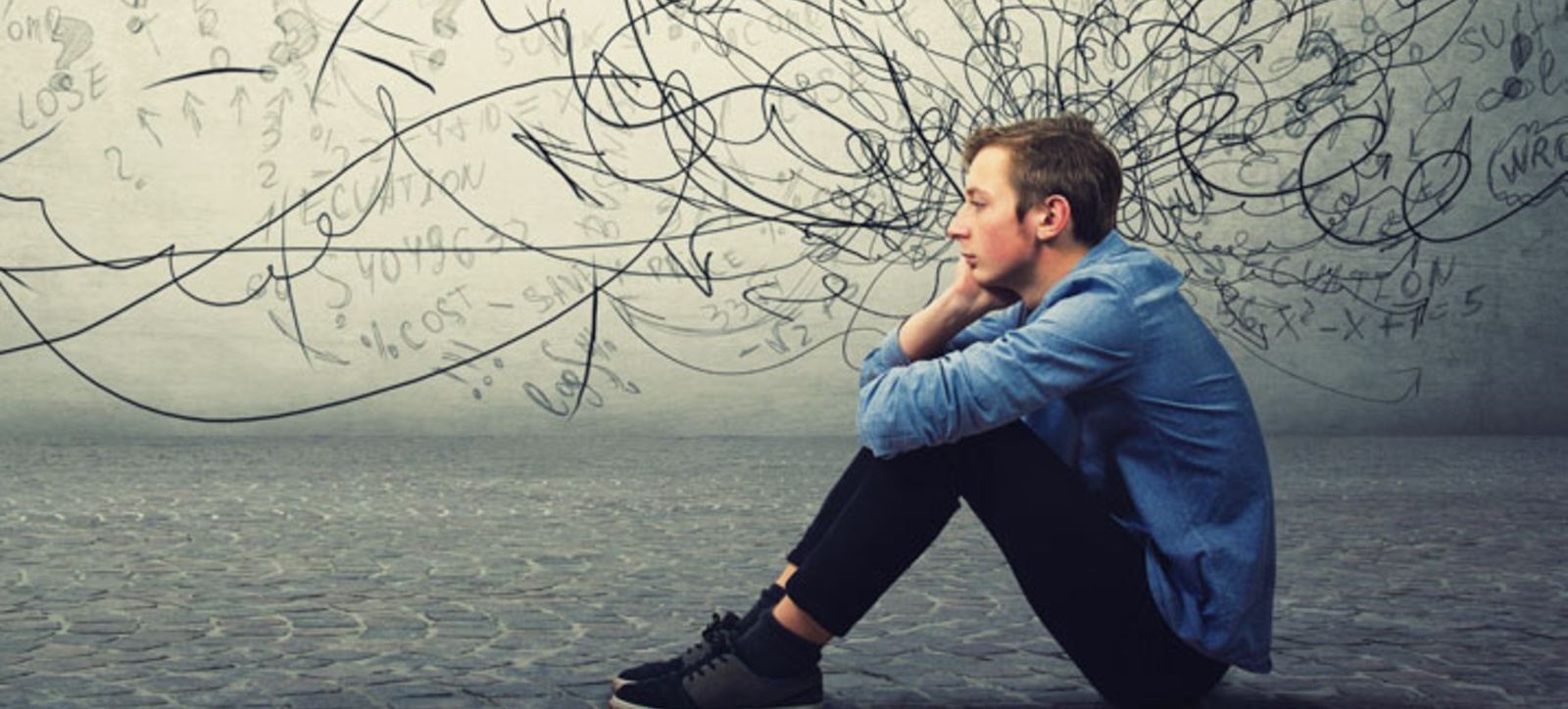 A man sitting on his own A man sitting on his own