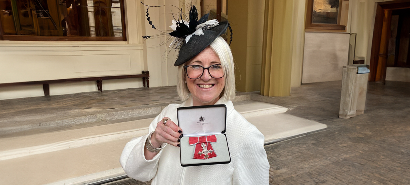 Paula Daes with her MBE at Windsor Castle Paula Daes with her MBE at Windsor Castle