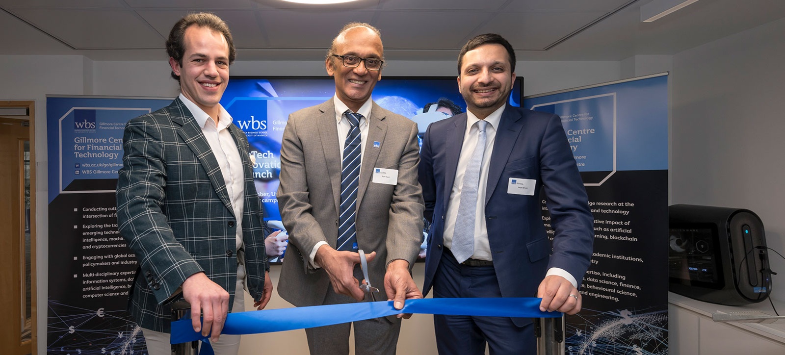 Investing in tomorrow: (l-r) Moris Strub, Course Director for the MSc Fintech, Ram Gopal, Director of the Gillmore Centre for Financial Technology, and Saqib Bhatti, Shadow Minister for Science, Innovation and Technology, opening the Fintech Innovation Lab by cutting the blue ribbon Investing in tomorrow: (l-r) Moris Strub, Course Director for the MSc Fintech, Ram Gopal, Director of the Gillmore Centre for Financial Technology, and Saqib Bhatti, Shadow Minister for Science, Innovation and Technology, opening the Fintech Innovation Lab by cutting the blue ribbon