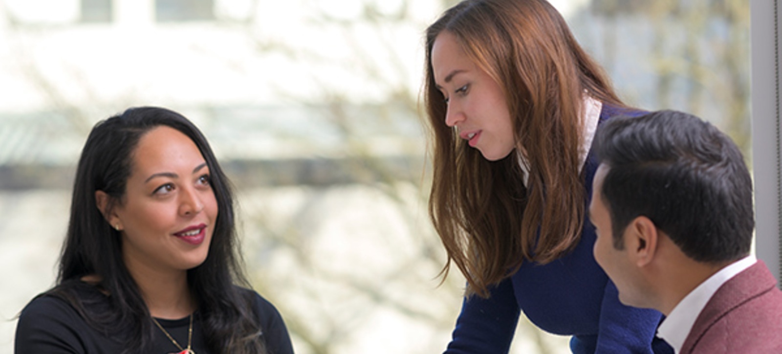 A female leader talk to staff A female leader talk to staff