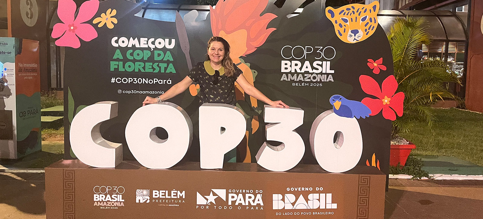Warwick Business School alum and Aue Natural Ltd founder Michelle Sartorio poses in front of a COP30 sign at the conference in Brazil in November 2025