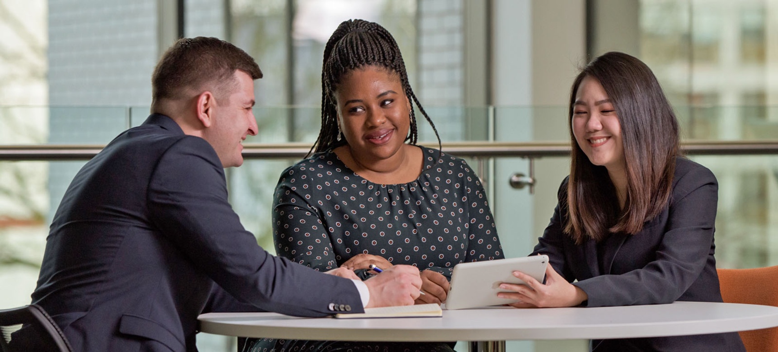 Students chat as they work together at Warwick Business School.