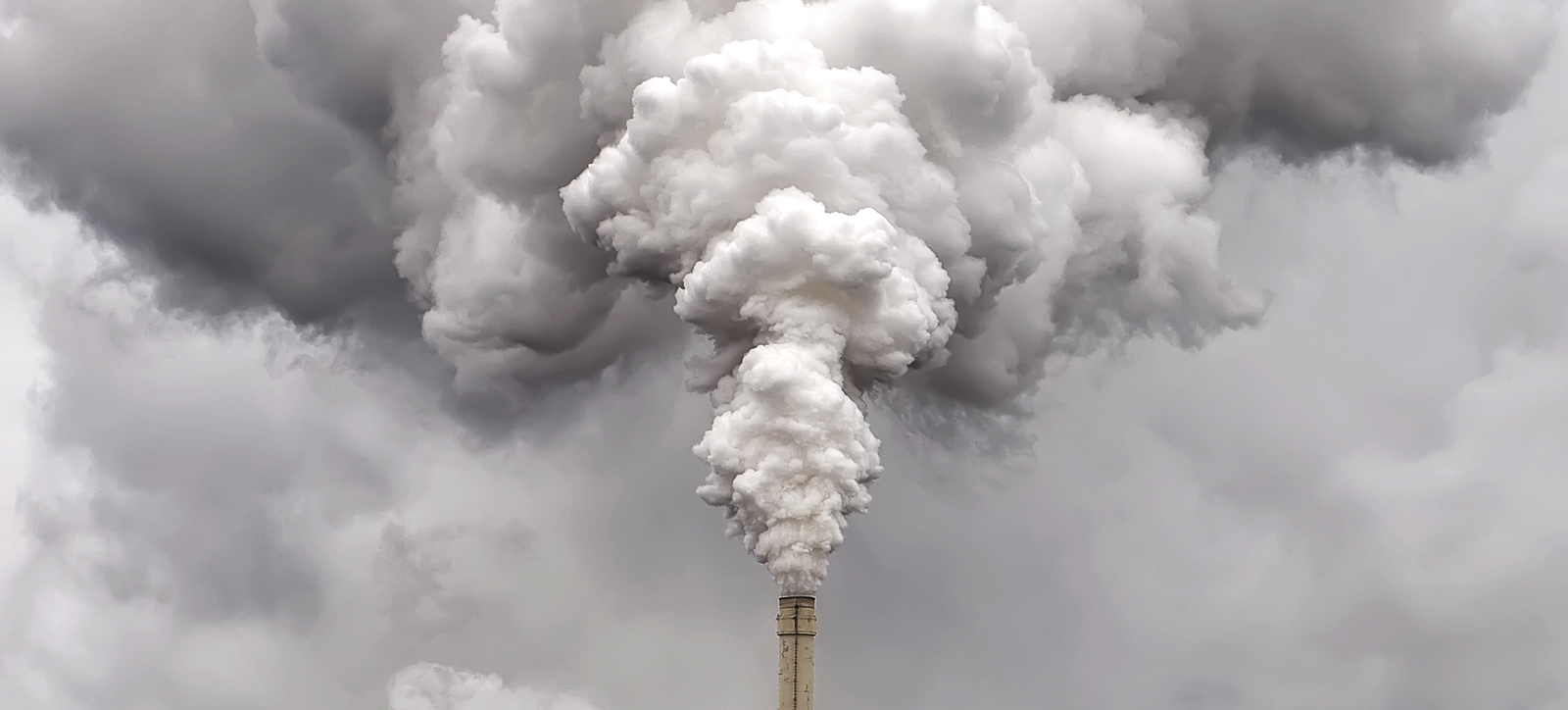 Smoke pouring out of a factory chimney