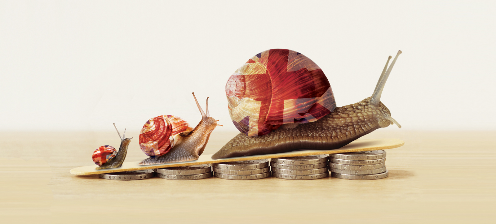 Three progressively larger snails with Union Jack flags on their shells climb a slope the is elevated by piles of pound coins (sterling). Three progressively larger snails with Union Jack flags on their shells climb a slope the is elevated by piles of pound coins (sterling).