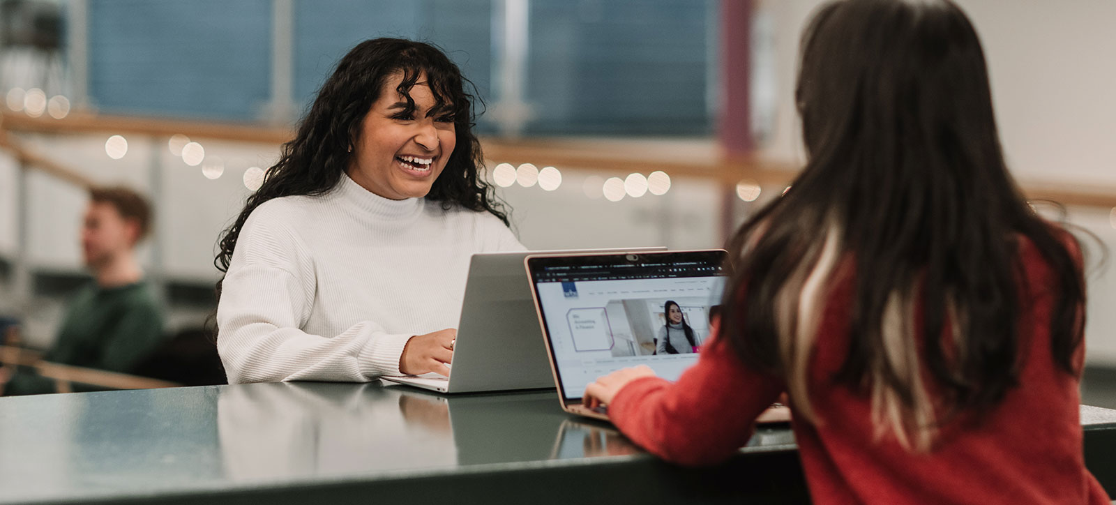 Two undergraduate students, girls, filling in the National Student Survey online