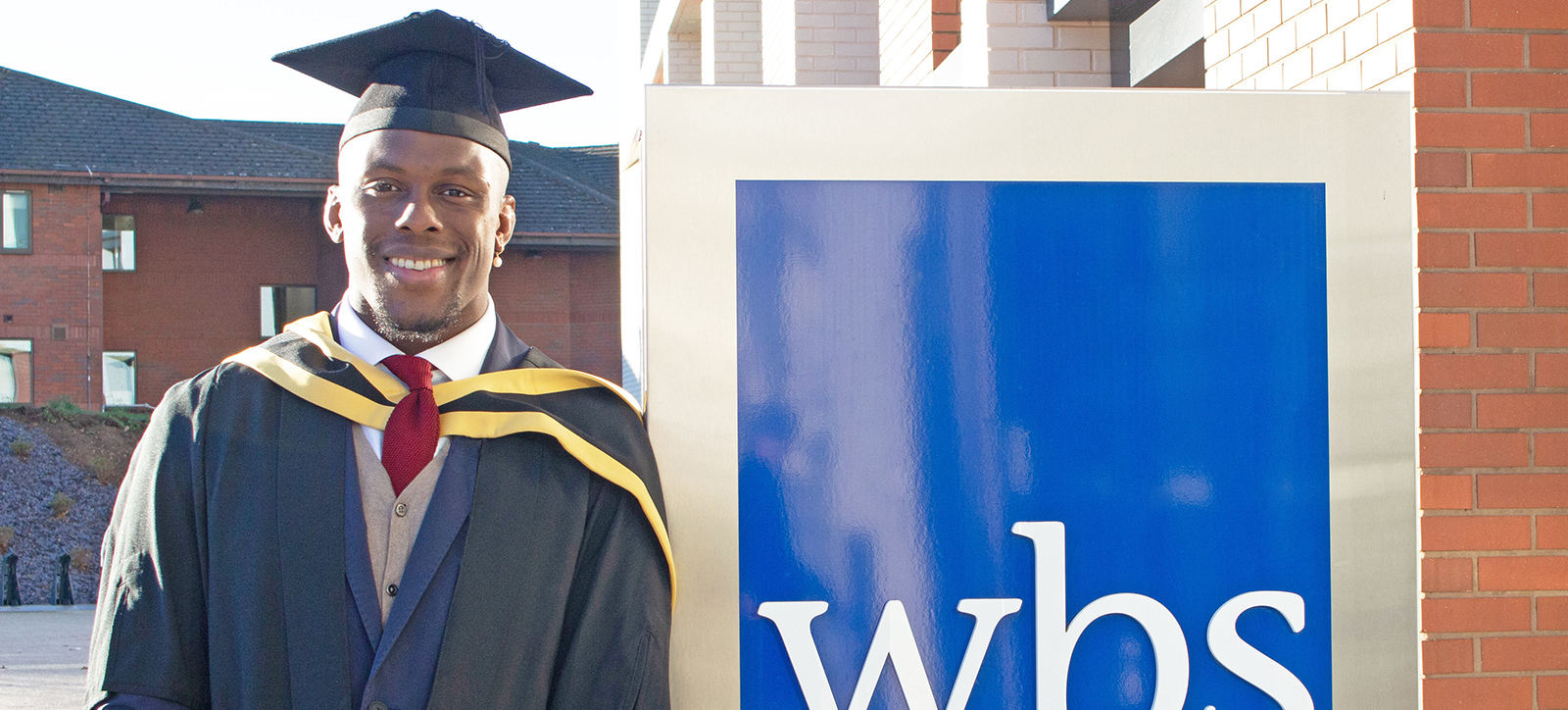 Maro Itoje in his cap and gown as he graduates with an MBA from Warwick Business School