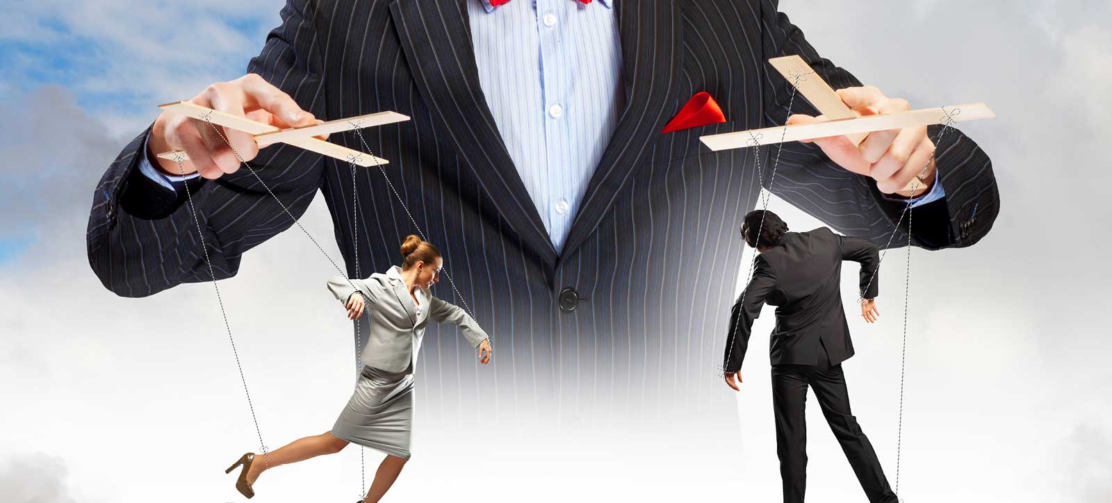 A giant CEO looms over two businesspeople in suits - one male and one female - controlling their every move like marionette puppets