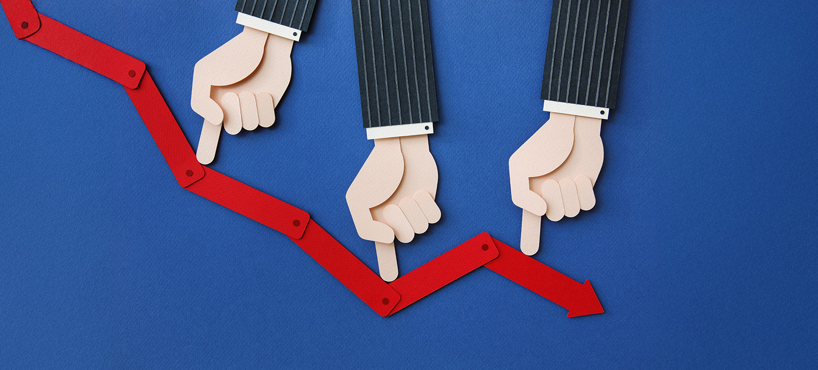 Three arms dressed in pinstriped suits descend from the top of the image. Each of them is using their index finger to push a line indicated financial performance lower and lower. Three arms dressed in pinstriped suits descend from the top of the image. Each of them is using their index finger to push a line indicated financial performance lower and lower.