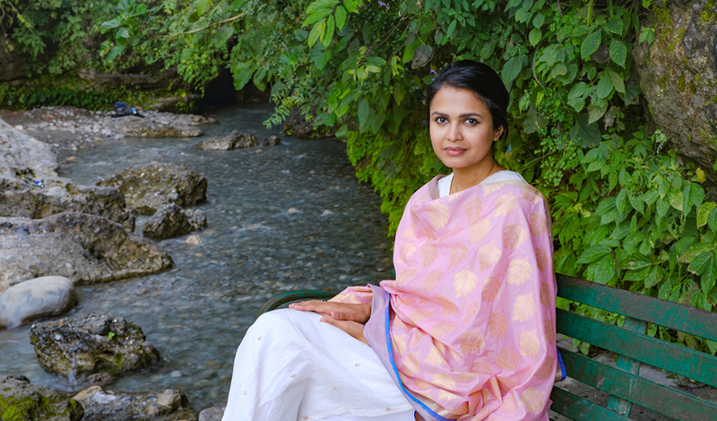 Gauri sitting on bench