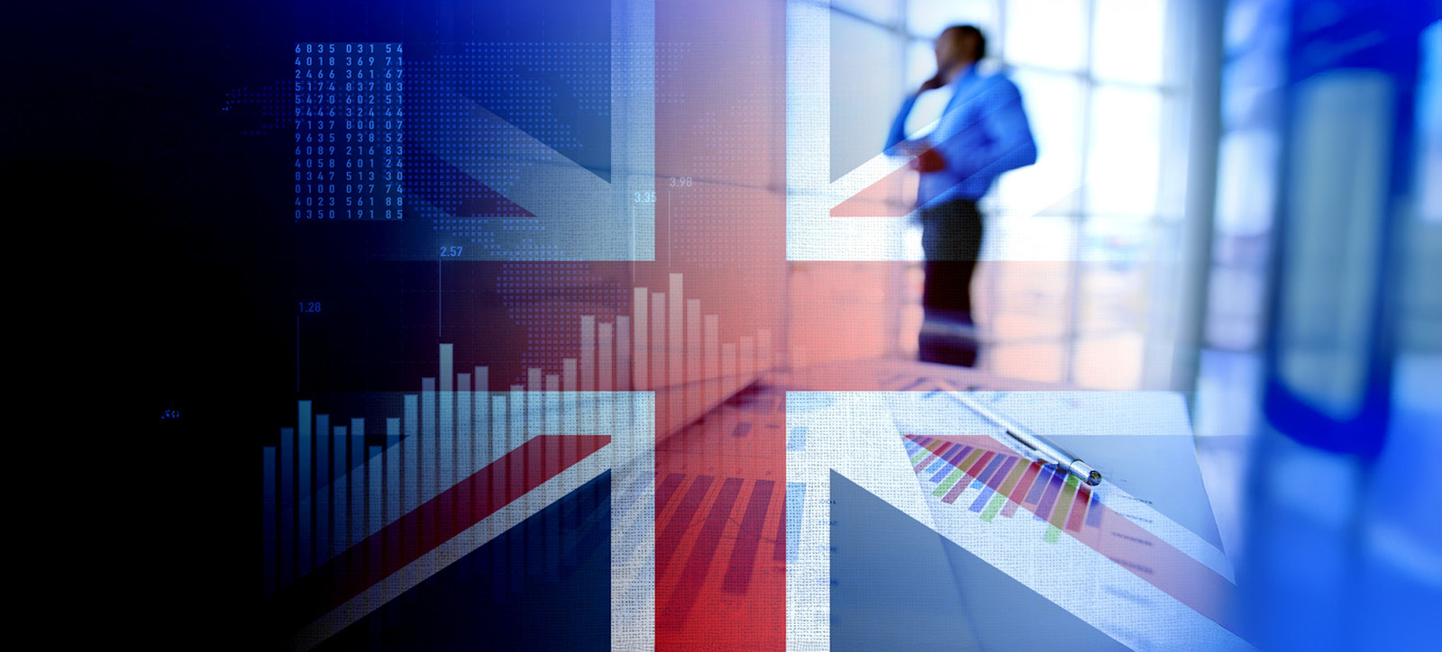 An image of the UK union flag superimposed on productivity graphs and a photograph of a business person in a suit talking on a mobile phone while they stand next to an office window.