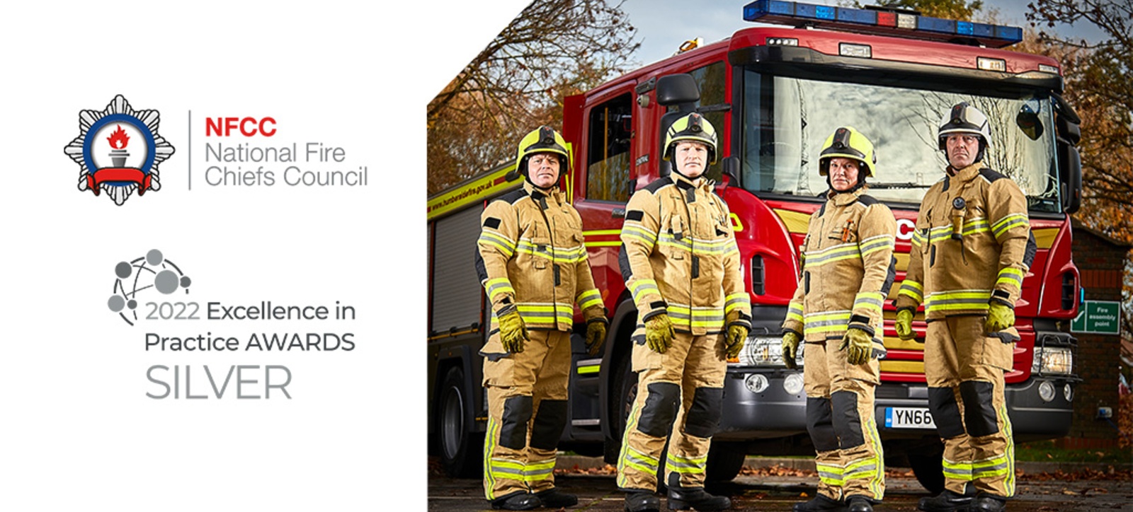 Firefighters with their engine, marking the fact that WBS won an EMFD award for its Executive Leadership Programme for the National Fire Chiefs Council.