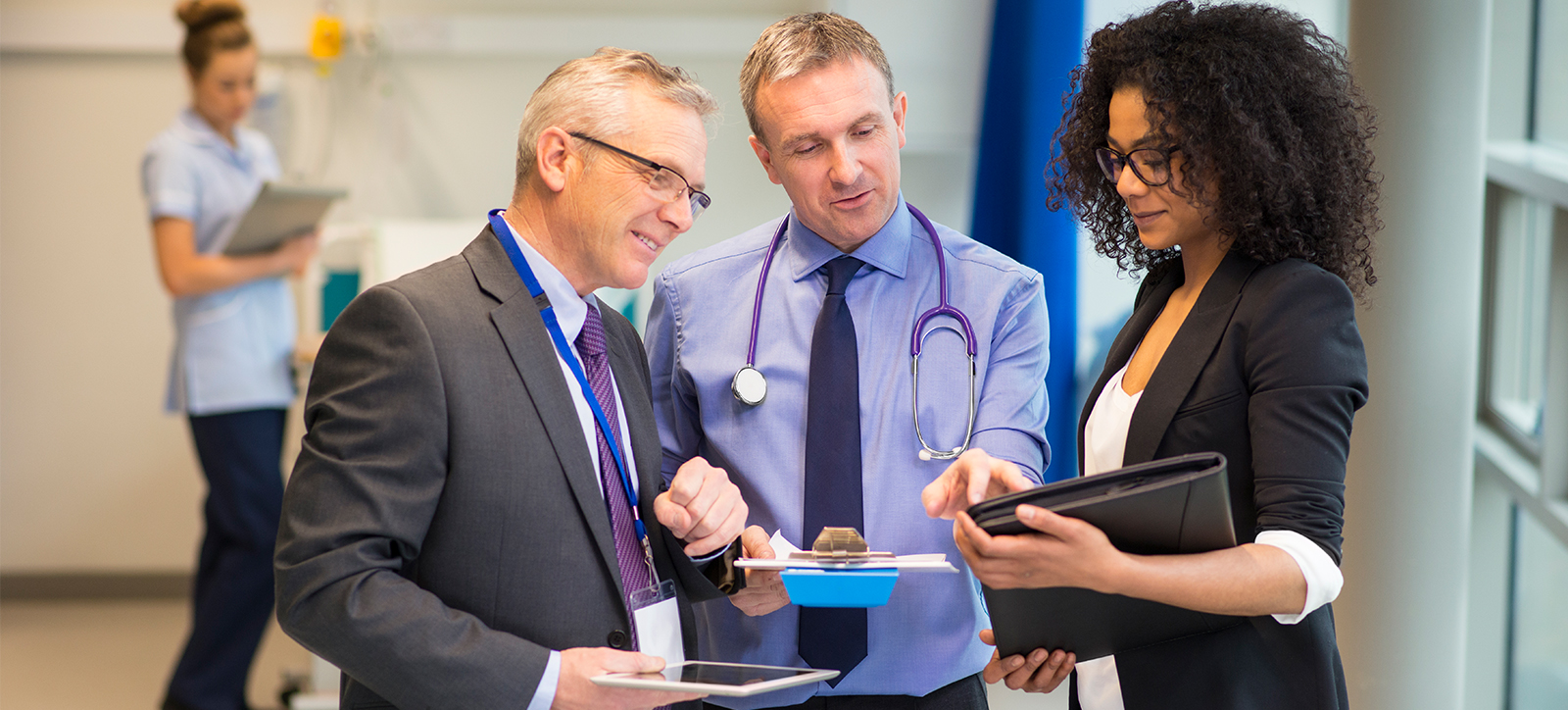 An NHS manager in a ward with doctors