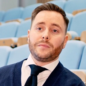 Image of an MBA alumni at a conference