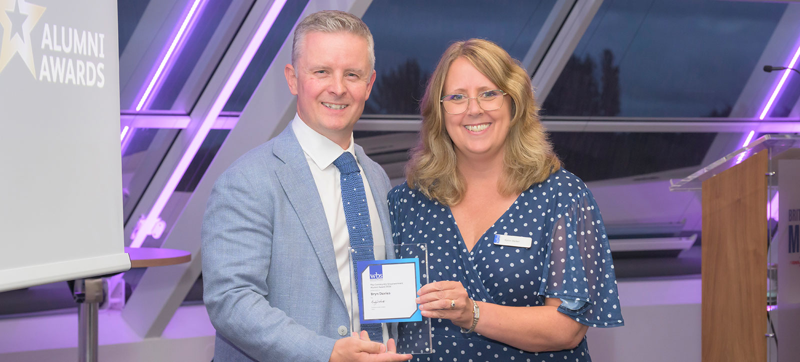 Bryn Davies collects his alumni award from Karen Barker, Director of Stakeholder Engagement at WBS Bryn Davies collects his alumni award from Karen Barker, Director of Stakeholder Engagement at WBS