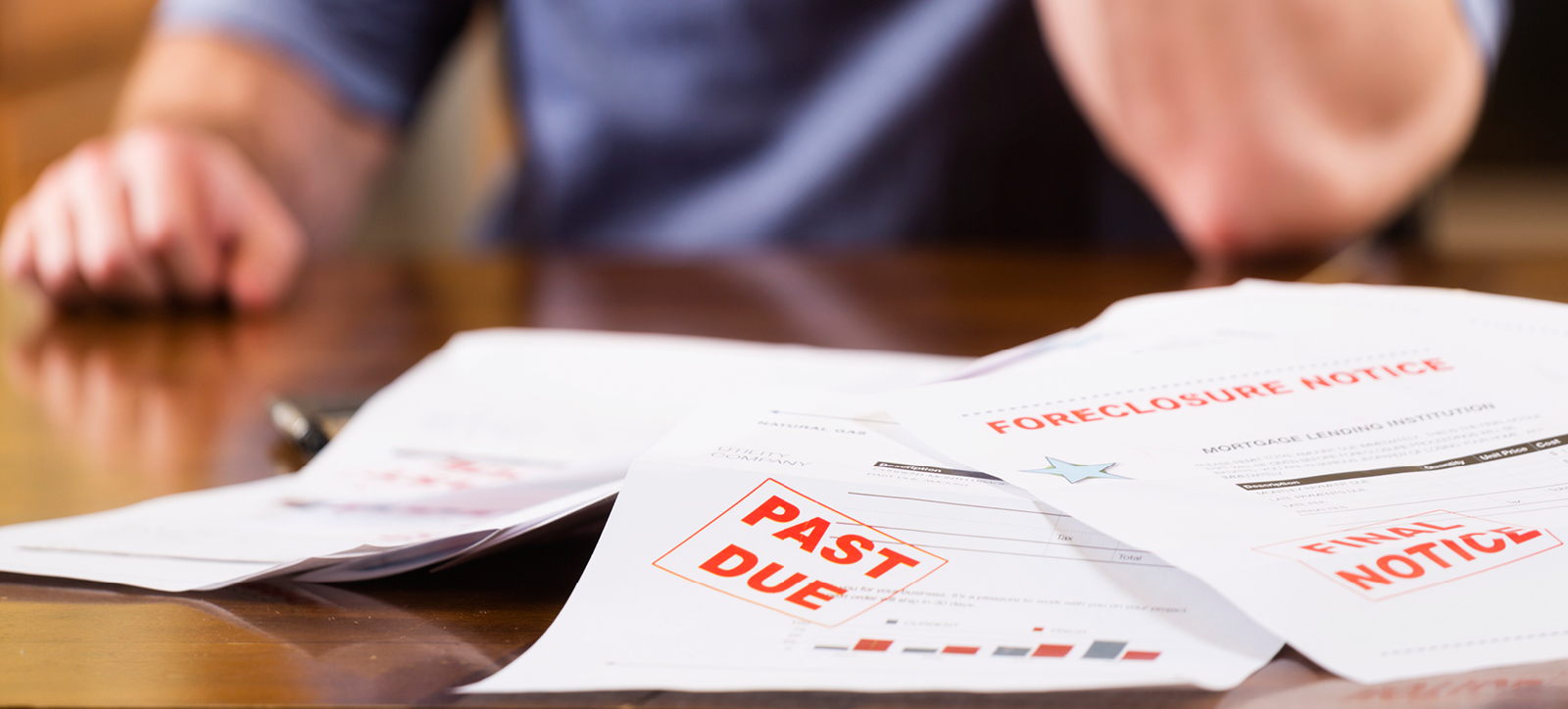 Picture of someone's hands with a late invoice as part of the UK's Commercial Payments Bill