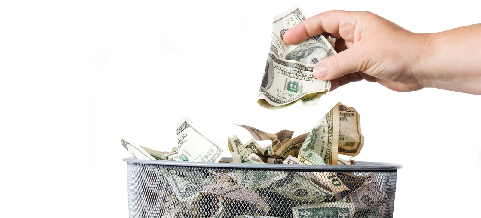 Money being thrown into a bin Money being thrown into a bin