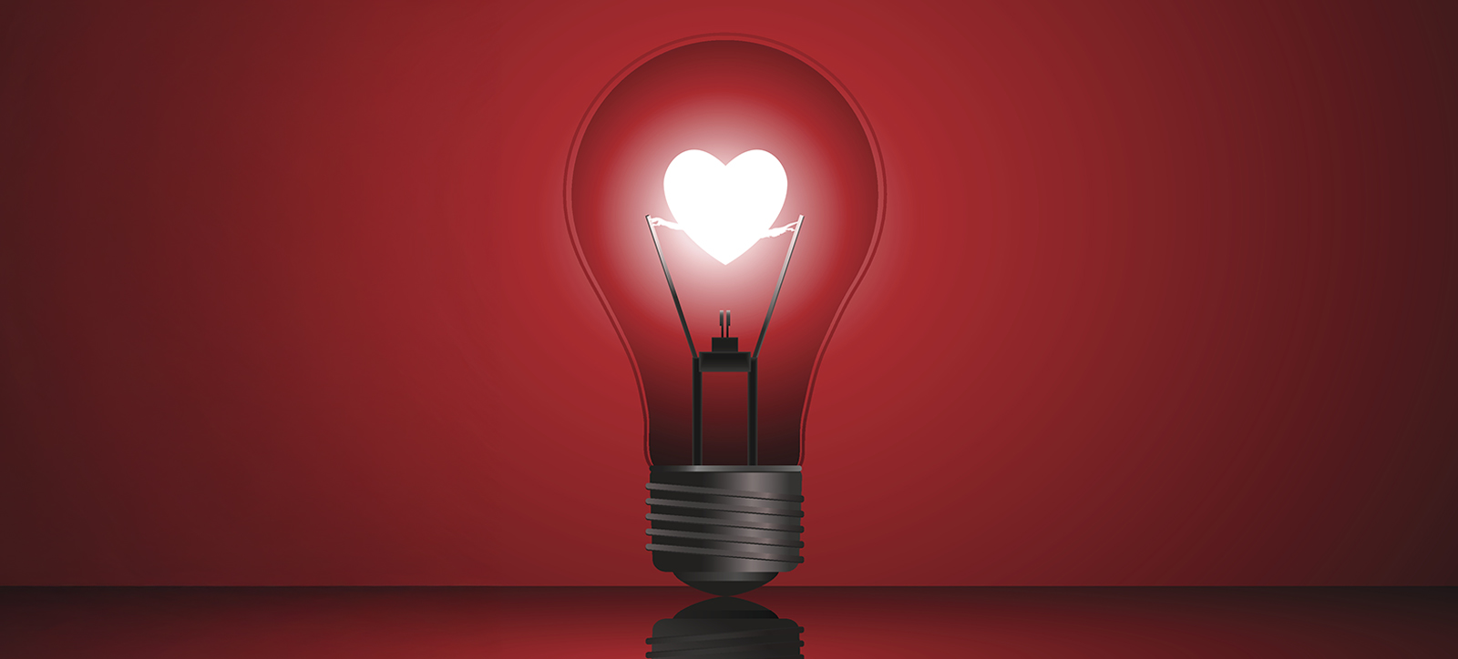 An image of a light bulb with a glowing filament in the shape of a heart. The bulb is stood upright, lit up in the manner often used to signify an idea. An image of a light bulb with a glowing filament in the shape of a heart. The bulb is stood upright, lit up in the manner often used to signify an idea.
