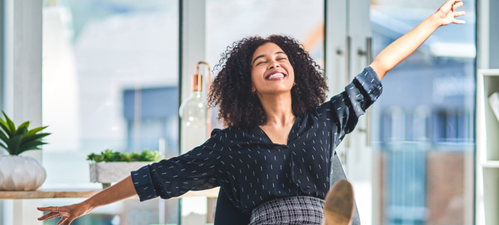 An female employee visibly enjoying their job.