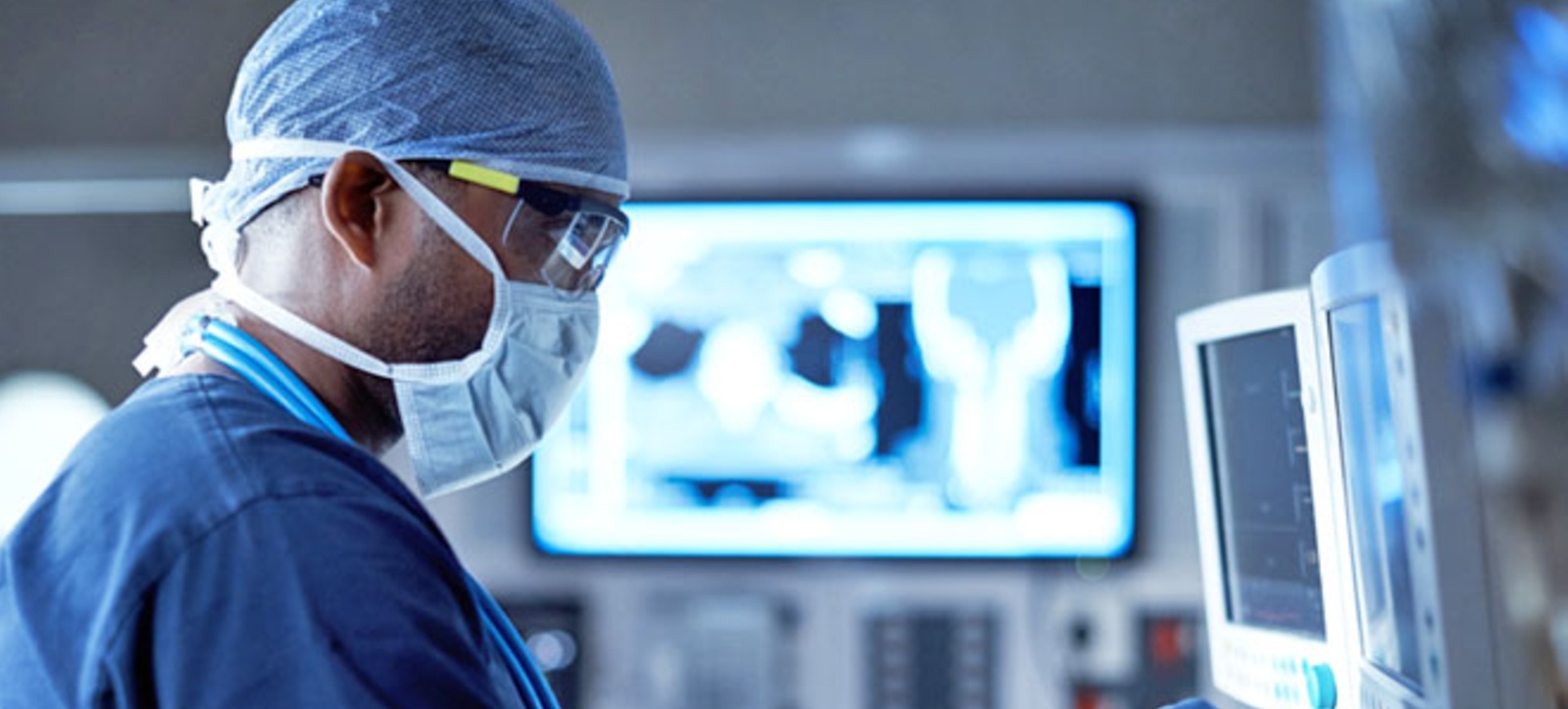 A surgeon working in an NHS ward A surgeon working in an NHS ward