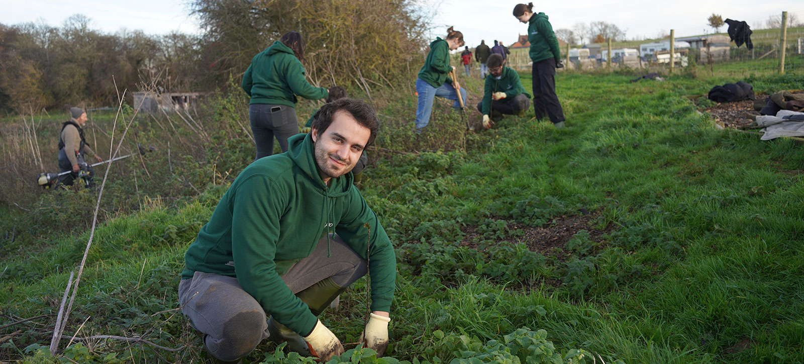 Godefroy Harito, founder of B-Corp Treeapp, planting trees that have been funded through adverts on his app.