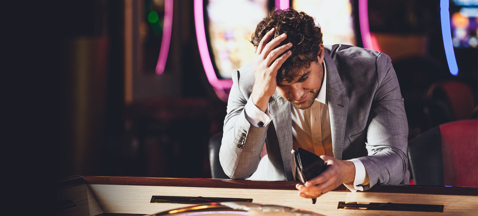 Man in despair at empty wallet Man in despair at empty wallet
