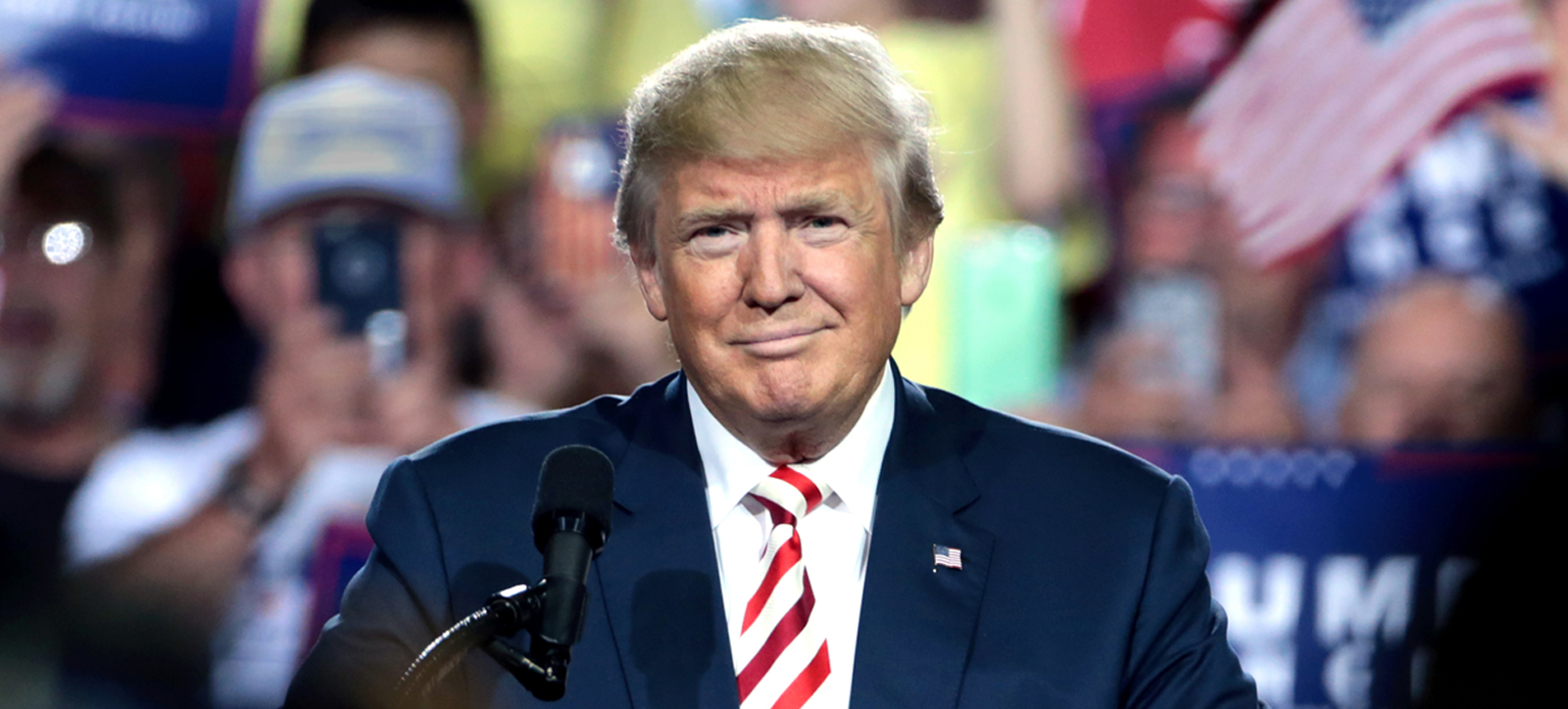 Donald Trump smiling at a rally