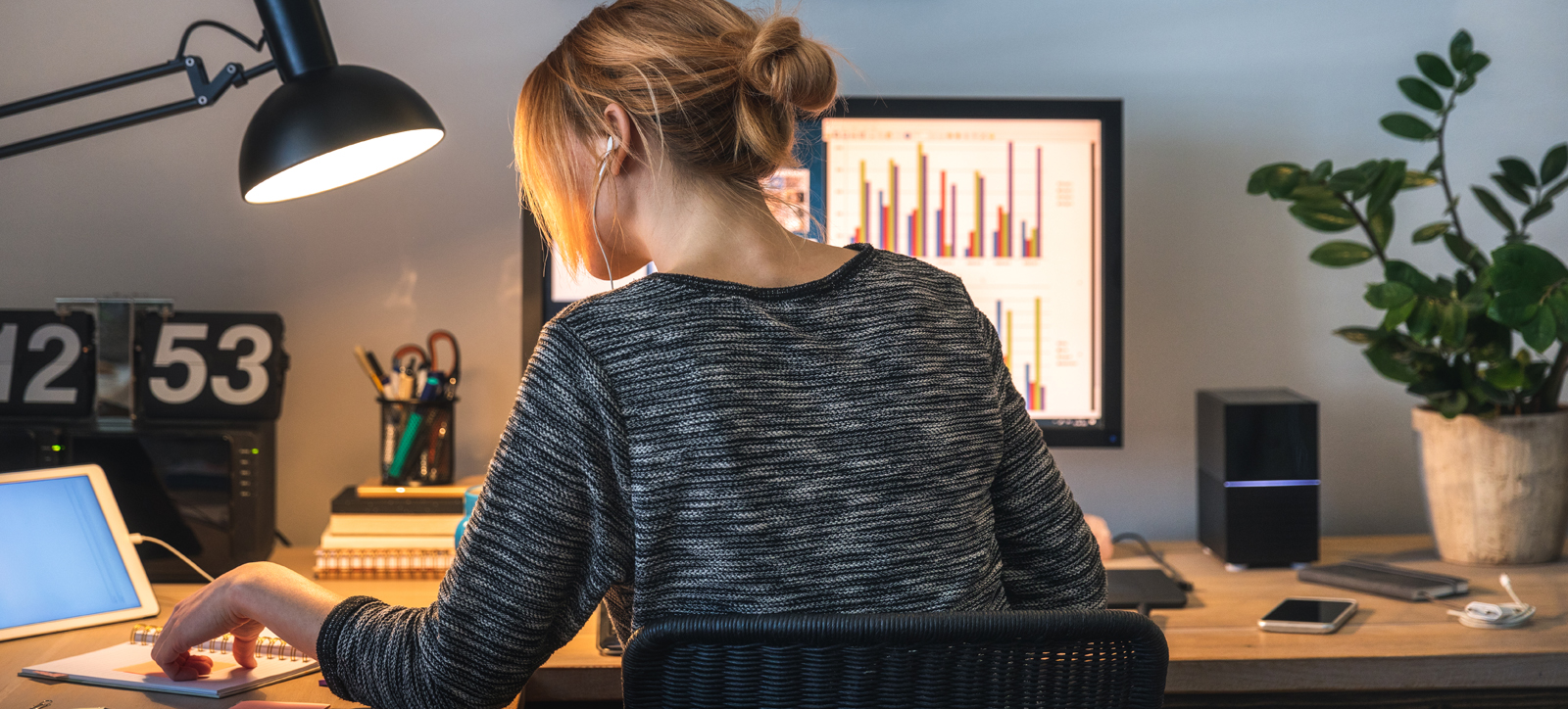 A worker at their computer at home.