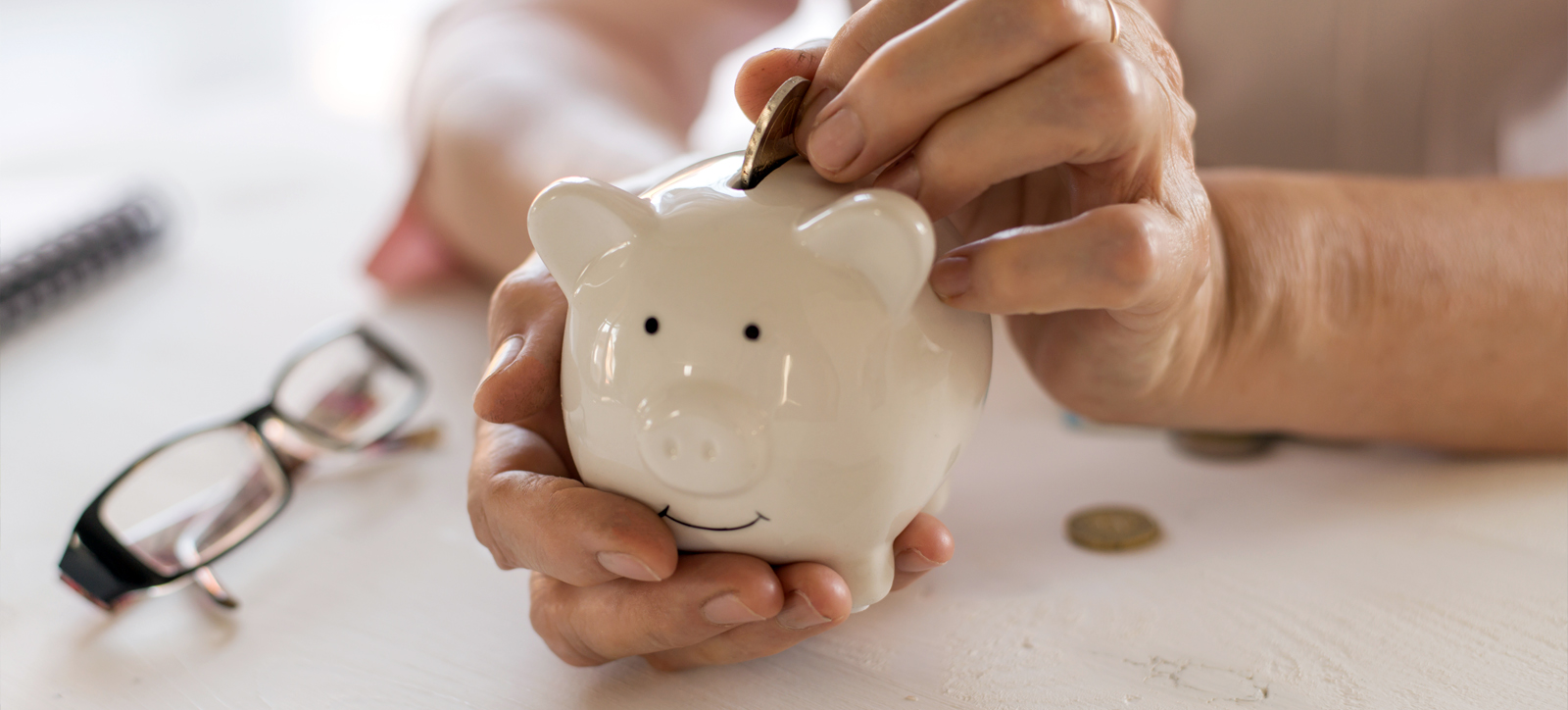 Putting coins in a piggy bank