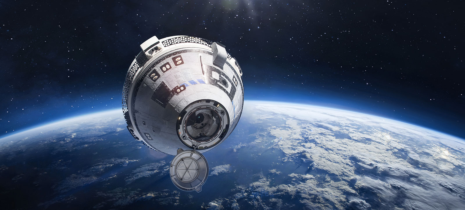 An image of the Boeing Starliner spacecraft high above the Earth. An image of the Boeing Starliner spacecraft high above the Earth.